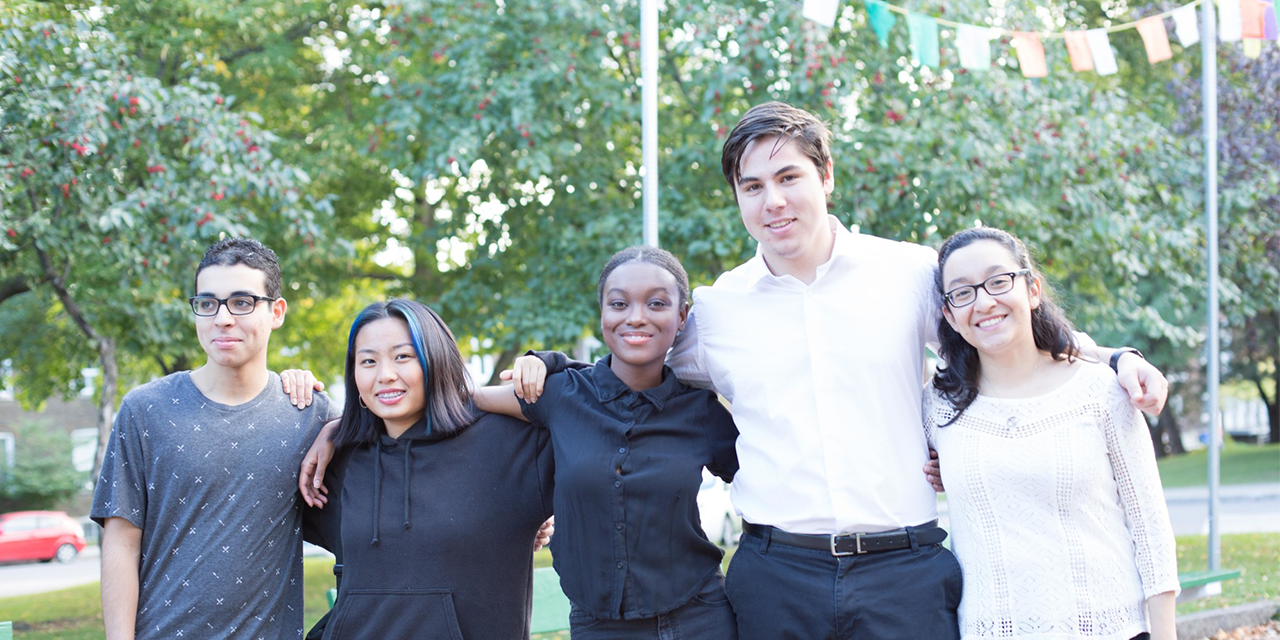 RS4871_cropped Group of Pathways students standing side by side with arms around each other